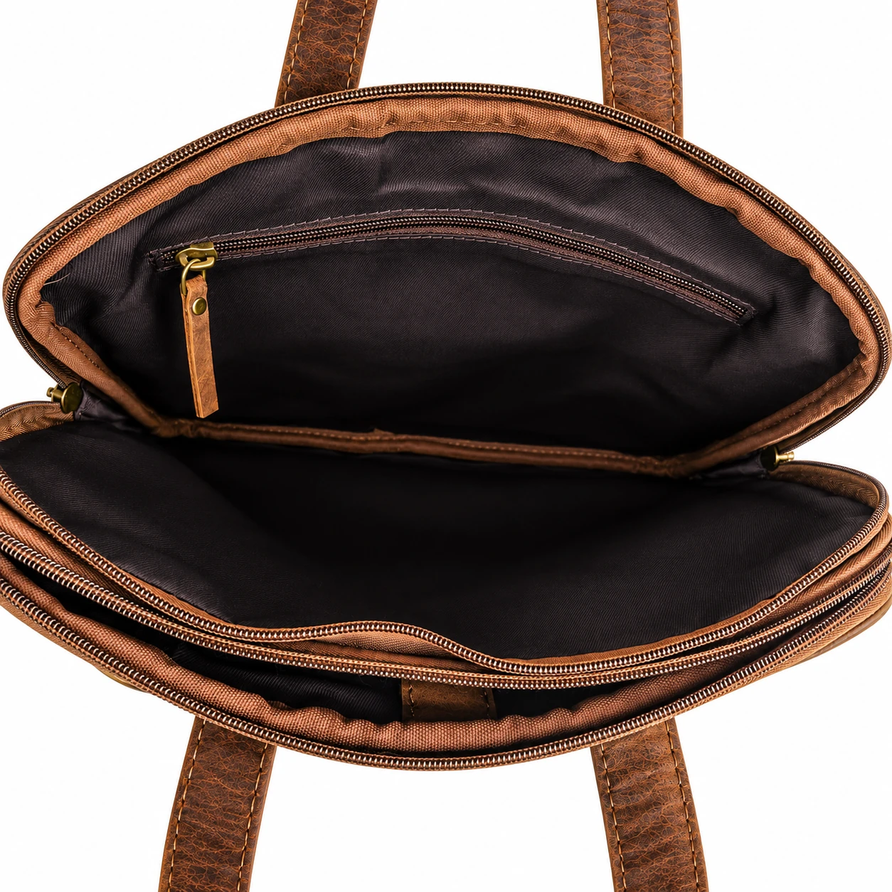 Close view inside brown leather laptop sleeve showing lining seams and zipped pocket